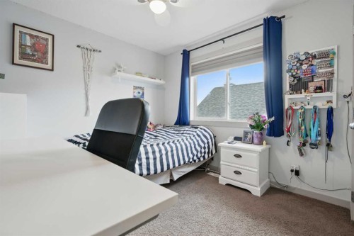 109 Crystal Green Bay, Okotoks, AB - Indoor Photo Showing Bedroom