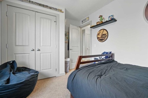 109 Crystal Green Bay, Okotoks, AB - Indoor Photo Showing Bedroom