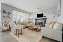 109 Crystal Green Bay, Okotoks, AB  - Indoor Photo Showing Living Room With Fireplace 