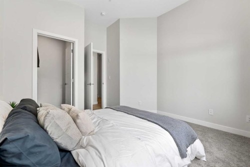 101-255 Les Jardins Park Se, Calgary, AB - Indoor Photo Showing Bedroom
