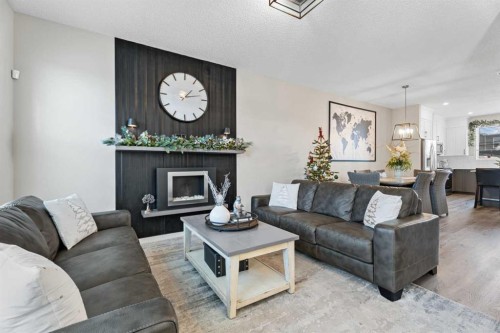 136 Dawson Drive, Chestermere, AB - Indoor Photo Showing Living Room With Fireplace