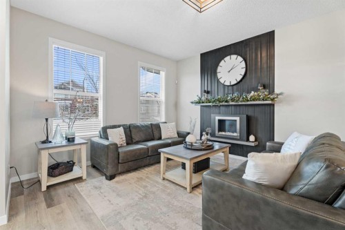 136 Dawson Drive, Chestermere, AB - Indoor Photo Showing Living Room With Fireplace