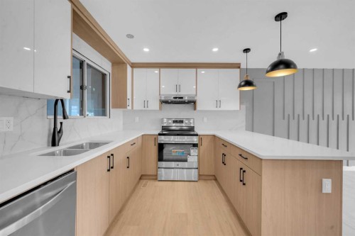 219 Falwood Way Ne, Calgary, AB - Indoor Photo Showing Kitchen With Stainless Steel Kitchen With Double Sink With Upgraded Kitchen