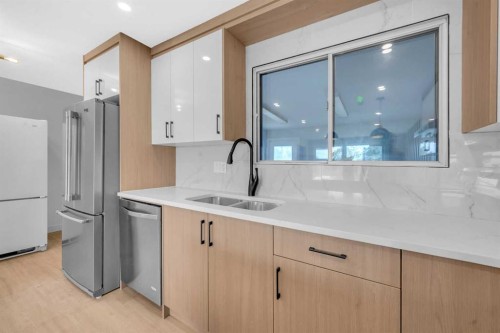 219 Falwood Way Ne, Calgary, AB - Indoor Photo Showing Kitchen With Double Sink