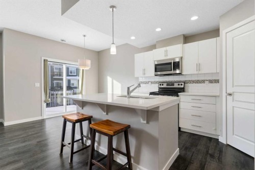 706-881 Sage Valley Boulevard Nw, Calgary, AB - Indoor Photo Showing Kitchen With Stainless Steel Kitchen With Upgraded Kitchen