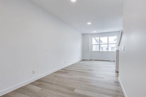202-437 Alpine Avenue Sw, Calgary, AB - Indoor Photo Showing Other Room