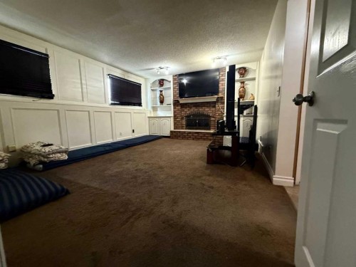 103 Templeson Way Ne, Calgary, AB - Indoor Photo Showing Other Room With Fireplace