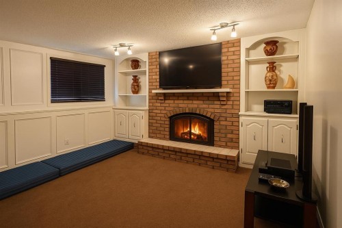 103 Templeson Way Ne, Calgary, AB - Indoor Photo Showing Living Room With Fireplace