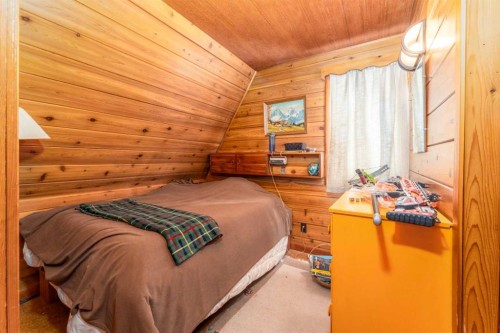 77 Grotto Road, Harvie Heights, AB - Indoor Photo Showing Bedroom