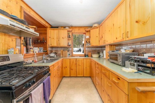 77 Grotto Road, Harvie Heights, AB - Indoor Photo Showing Kitchen With Double Sink