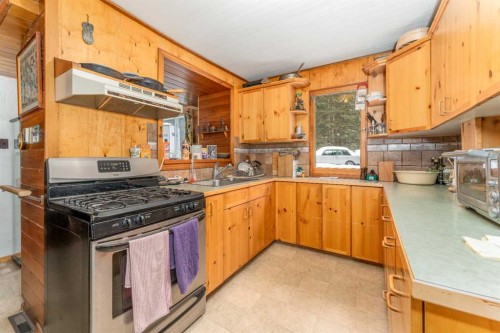 77 Grotto Road, Harvie Heights, AB - Indoor Photo Showing Kitchen With Double Sink