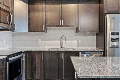 2403-3727 Sage Hill Drive, Calgary, AB - Indoor Photo Showing Kitchen With Upgraded Kitchen