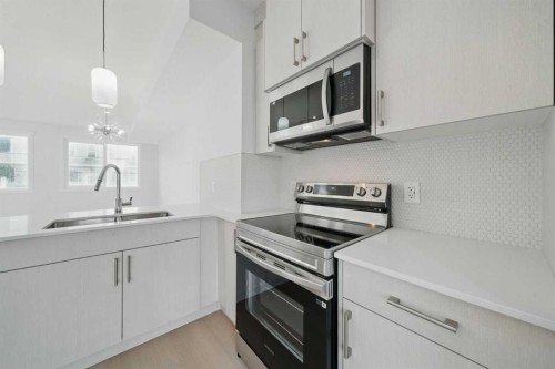 106-75 Cornerstone Row Ne, Calgary, AB - Indoor Photo Showing Kitchen With Stainless Steel Kitchen With Double Sink With Upgraded Kitchen