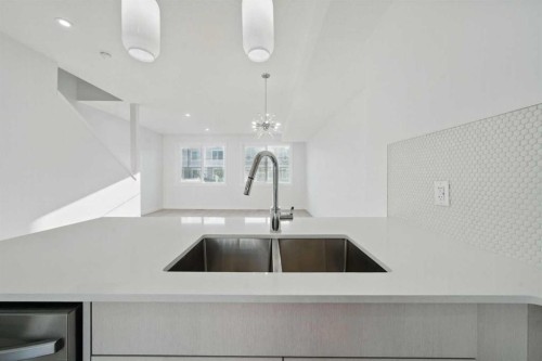 106-75 Cornerstone Row Ne, Calgary, AB - Indoor Photo Showing Kitchen With Double Sink