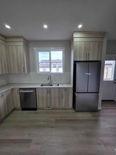 156 Belvedere Park Se, Calgary, AB - Indoor Photo Showing Kitchen With Double Sink
