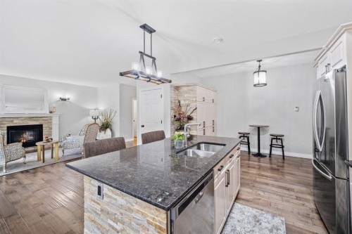 187 Gleneagles View, Cochrane, AB - Indoor Photo Showing Kitchen With Double Sink
