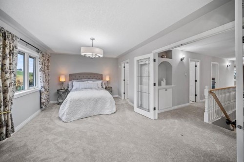 187 Gleneagles View, Cochrane, AB - Indoor Photo Showing Bedroom