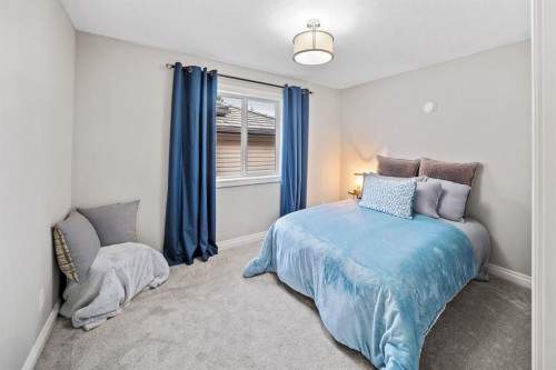 187 Gleneagles View, Cochrane, AB - Indoor Photo Showing Bedroom
