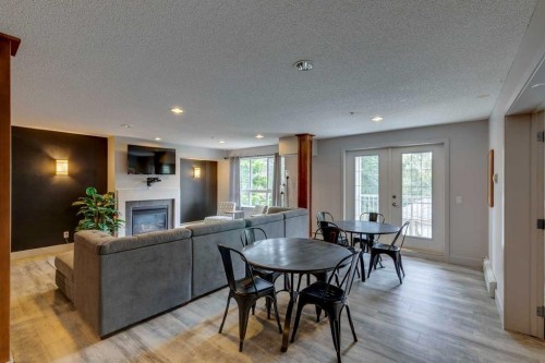 438-35 Richard Court Sw, Calgary, AB - Indoor With Fireplace