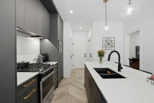 104-4275 Norford Avenue Nw, Calgary, AB - Indoor Photo Showing Kitchen With Double Sink With Upgraded Kitchen