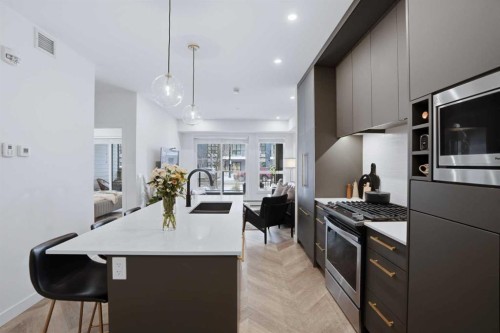 104-4275 Norford Avenue Nw, Calgary, AB - Indoor Photo Showing Kitchen With Upgraded Kitchen