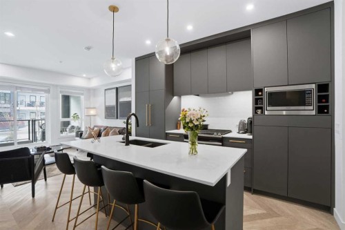 104-4275 Norford Avenue Nw, Calgary, AB - Indoor Photo Showing Kitchen With Double Sink With Upgraded Kitchen