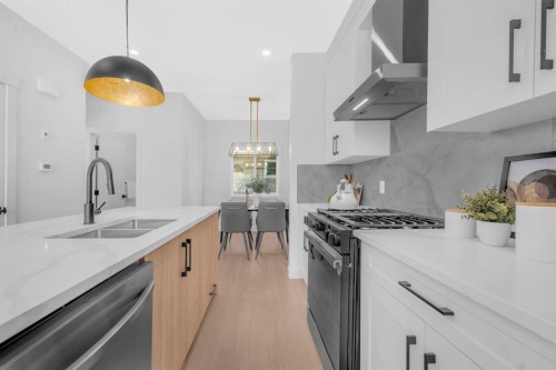 1846 24 Avenue Nw, Calgary, AB - Indoor Photo Showing Kitchen With Double Sink With Upgraded Kitchen