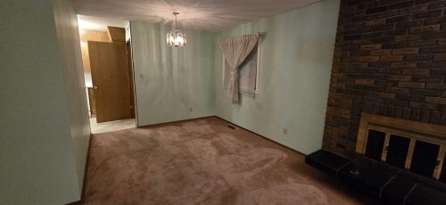 6320 Rundlehorn Drive Ne, Calgary, AB - Indoor Photo Showing Other Room With Fireplace