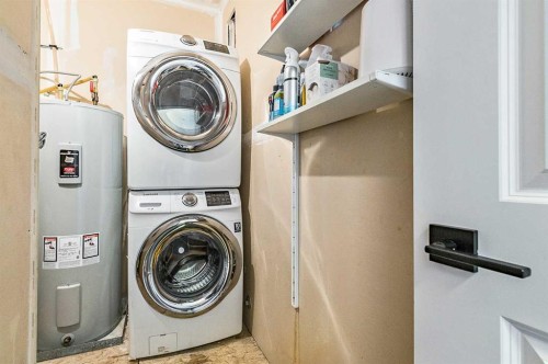 1-67 West Coach Manor Sw, Calgary, AB - Indoor Photo Showing Laundry Room