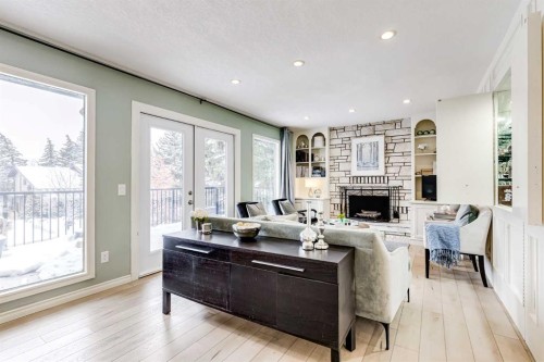980 Edgemont Road Nw, Calgary, AB - Indoor Photo Showing Living Room With Fireplace