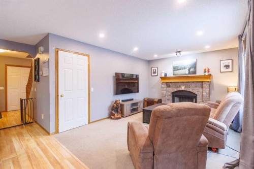 123 Riverwood Circle Se, Calgary, AB - Indoor Photo Showing Living Room With Fireplace