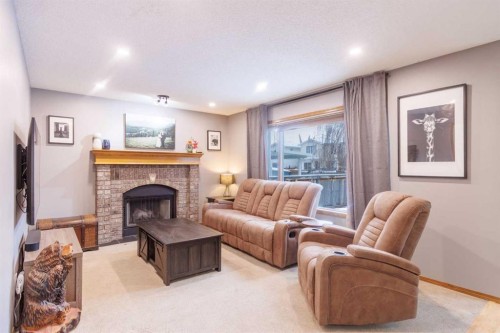 123 Riverwood Circle Se, Calgary, AB - Indoor Photo Showing Living Room With Fireplace