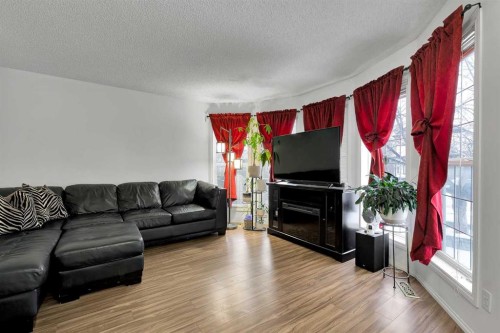298 Taravista Street Ne, Calgary, AB - Indoor Photo Showing Living Room