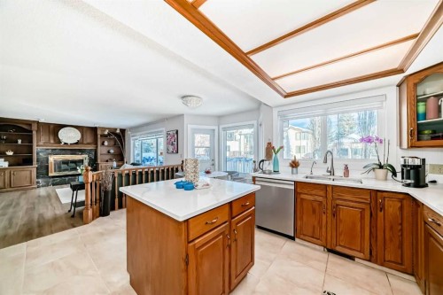 8328 Edgevalley Drive Nw, Calgary, AB - Indoor Photo Showing Kitchen With Fireplace