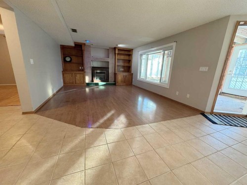 8328 Edgevalley Drive Nw, Calgary, AB - Indoor With Fireplace