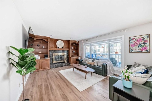 8328 Edgevalley Drive Nw, Calgary, AB - Indoor Photo Showing Living Room With Fireplace