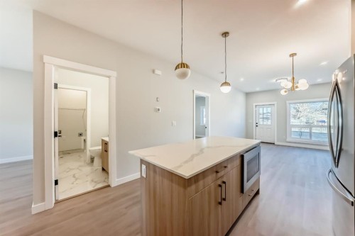 1102 Clover Close, Carstairs, AB - Indoor Photo Showing Kitchen