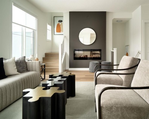 229-380 Seton Villas Se, Calgary, AB - Indoor Photo Showing Living Room With Fireplace