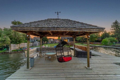 700 West Chestermere Drive, Chestermere, AB - Outdoor With Body Of Water With Deck Patio Veranda