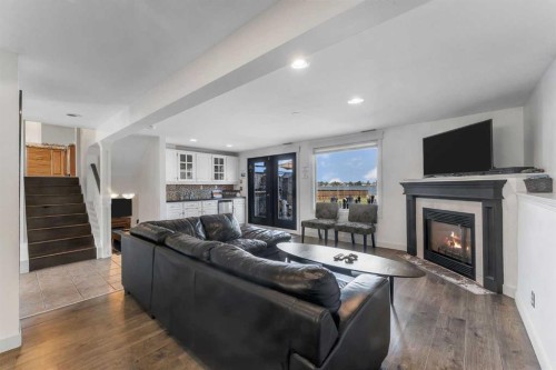 700 West Chestermere Drive, Chestermere, AB - Indoor Photo Showing Living Room With Fireplace