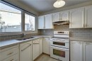 9-1111 Canterbury Drive Sw, Calgary, AB  - Indoor Photo Showing Kitchen With Double Sink 