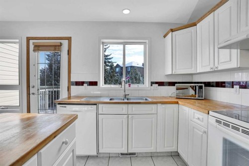 46 Somerset Close Sw, Calgary, AB - Indoor Photo Showing Kitchen With Double Sink