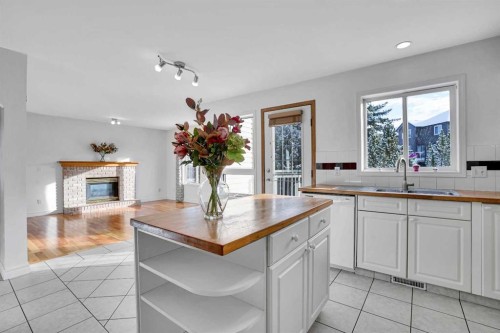 46 Somerset Close Sw, Calgary, AB - Indoor Photo Showing Other Room With Fireplace