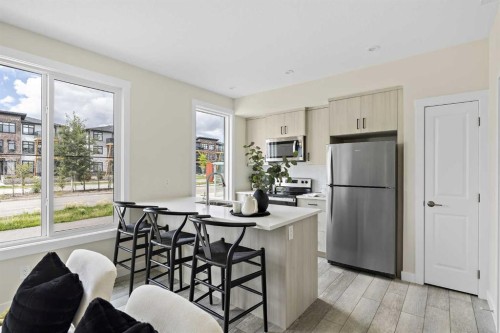 253-380 Seton Villas Se, Calgary, AB - Indoor Photo Showing Kitchen With Stainless Steel Kitchen