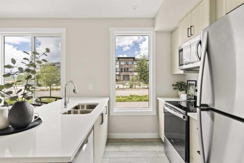 253-380 Seton Villas Se, Calgary, AB - Indoor Photo Showing Kitchen With Double Sink