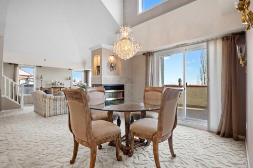 3249-1818 Simcoe Boulevard Sw, Calgary, AB - Indoor Photo Showing Dining Room With Fireplace