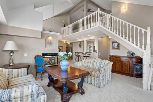 3249-1818 Simcoe Boulevard Sw, Calgary, AB - Indoor Photo Showing Living Room With Fireplace