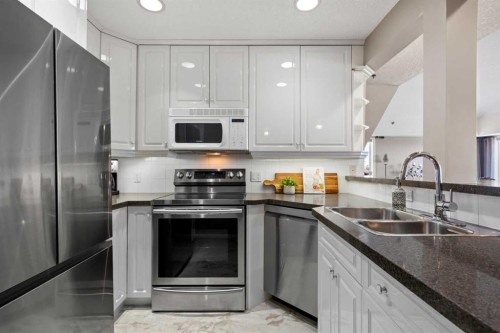 3249-1818 Simcoe Boulevard Sw, Calgary, AB - Indoor Photo Showing Kitchen With Stainless Steel Kitchen With Double Sink With Upgraded Kitchen