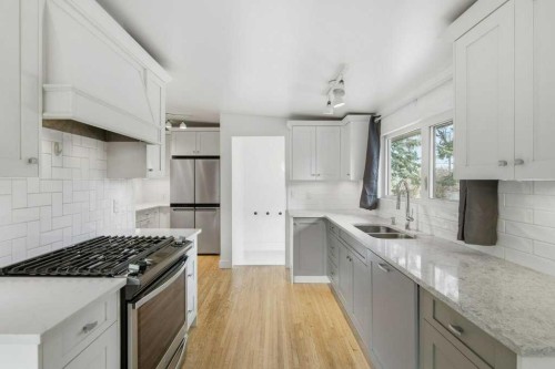3124 Leduc Crescent Sw, Calgary, AB - Indoor Photo Showing Kitchen With Double Sink With Upgraded Kitchen