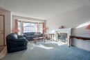 82 Martinridge Crescent Ne, Calgary, AB  - Indoor Photo Showing Living Room With Fireplace 